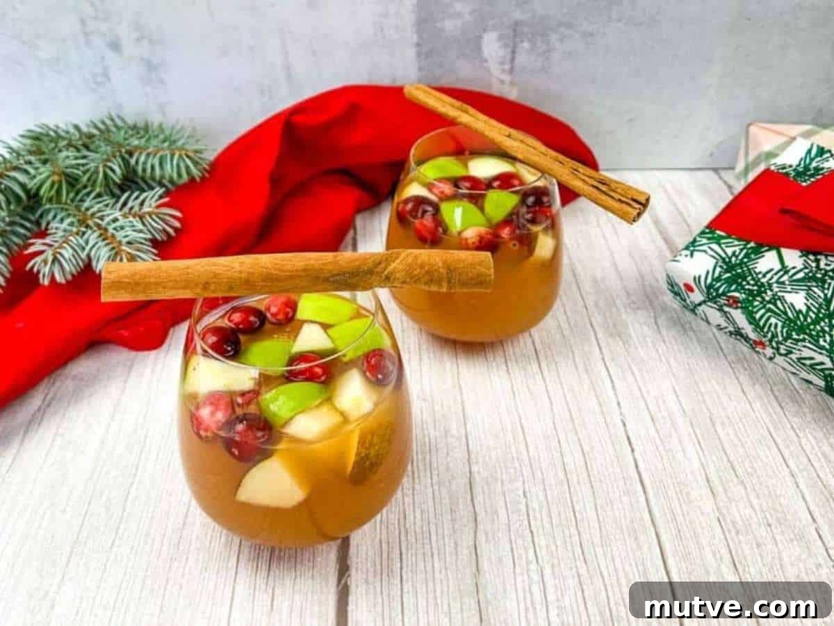 29 Halloween Treats That Beat Your Trick-or-Treat Candy 28 Two glasses of cider sangria with cinnamon sticks.