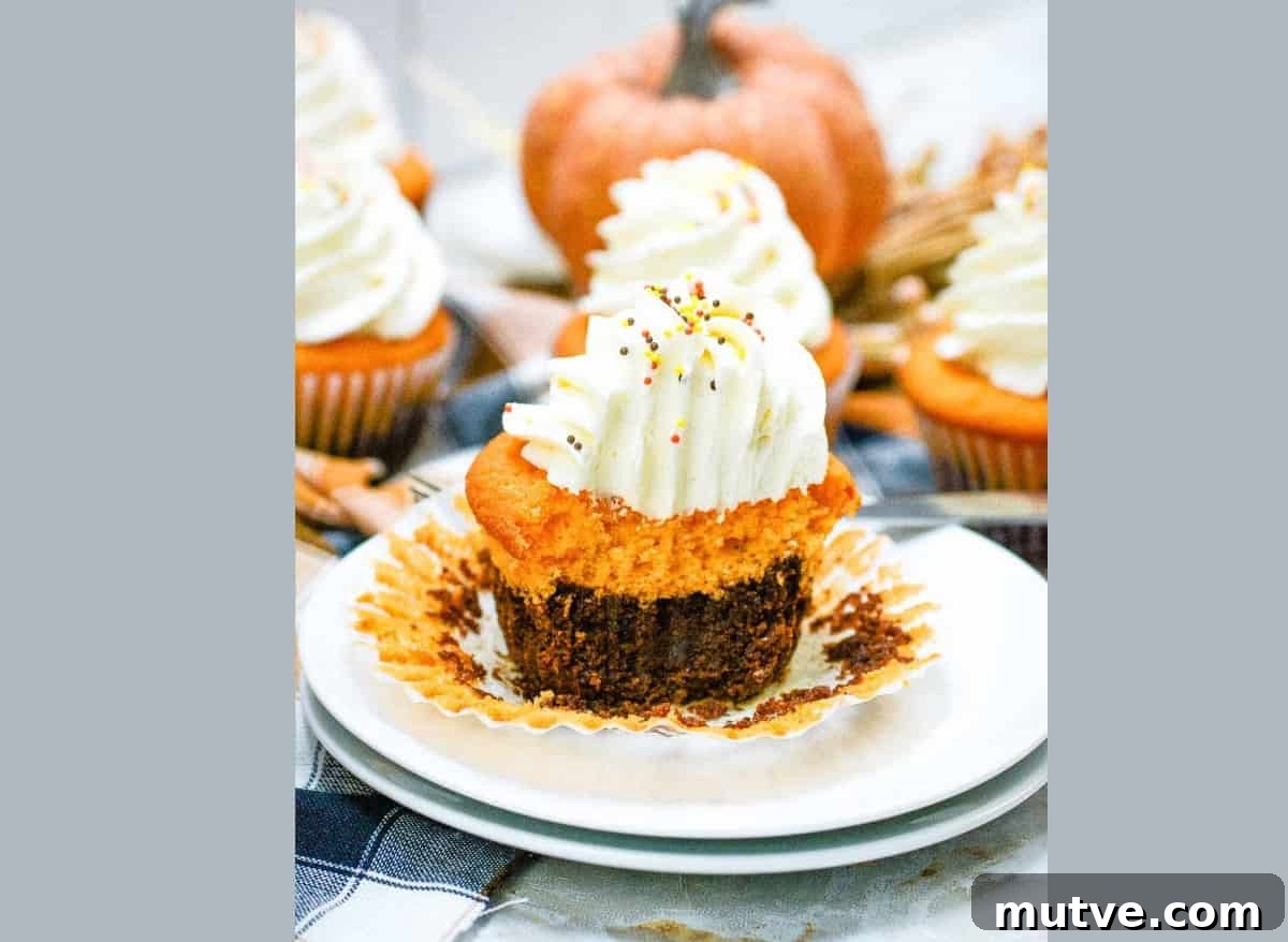 29 Halloween Treats That Beat Your Trick-or-Treat Candy 30 Fall brownie cupcakes with whipped cream on a plate.