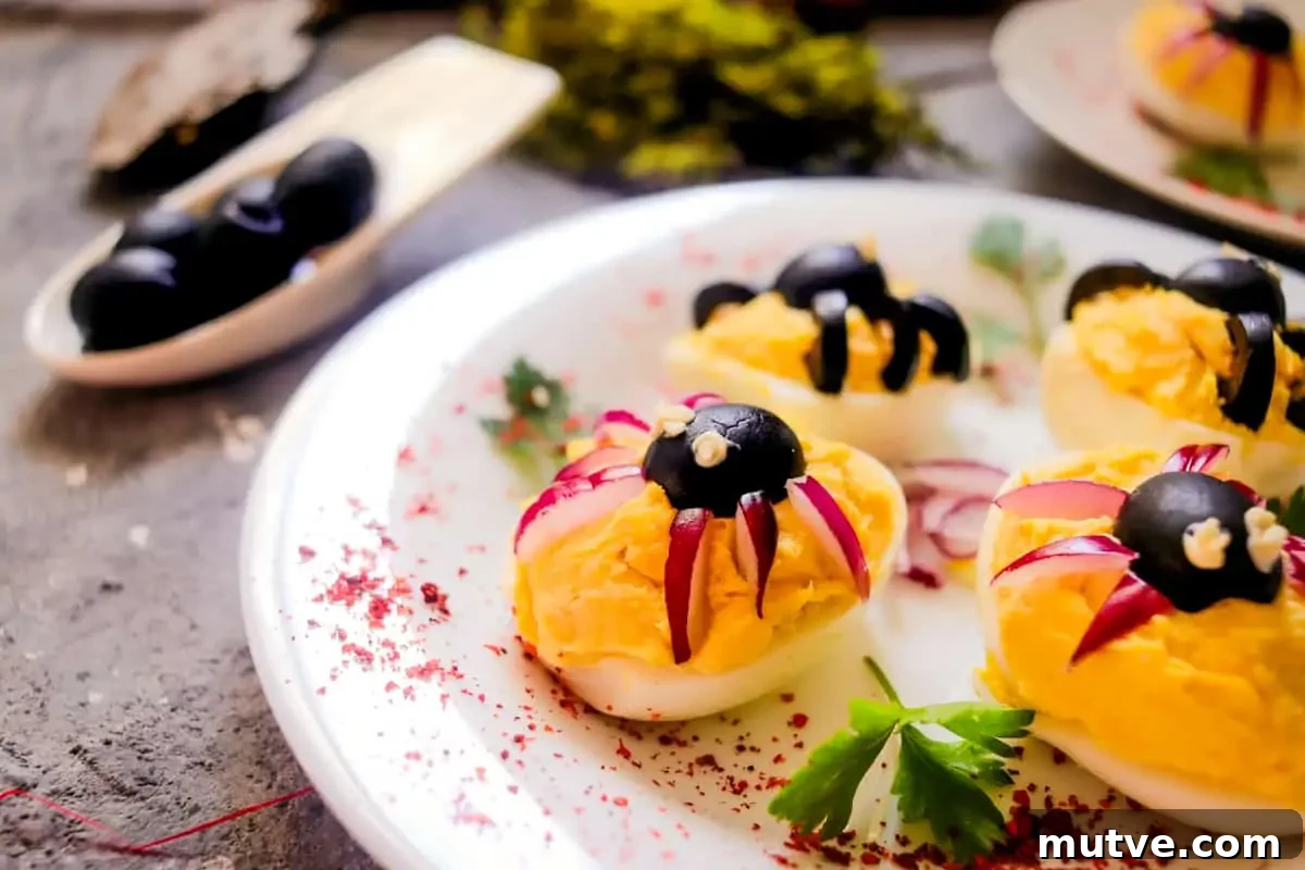 29 Halloween Treats That Beat Your Trick-or-Treat Candy 8 Deviled eggs with black olive spiders.