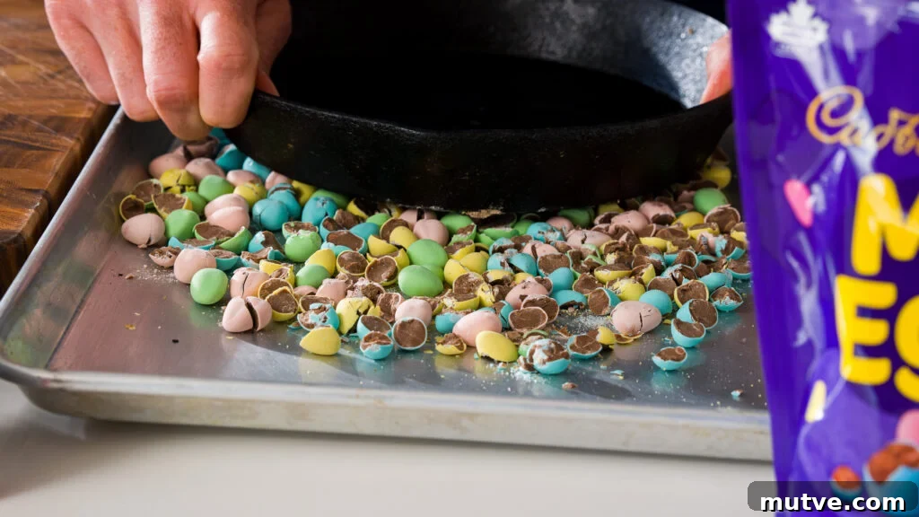 Crushing mini eggs to make a delicious Cadbury mini egg Easter cookie recipe.