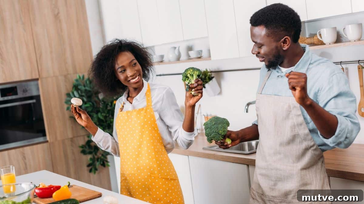 happy couple cooking and dancing