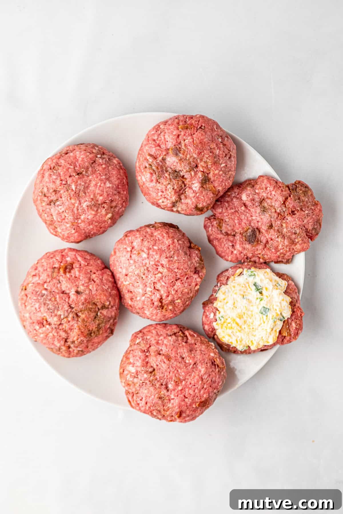 Juicy Jalapeno Popper Stuffed Burger with Bacon and Cream Cheese 7 Ground beef formed into patties stuffed with jalapeno cheese spread for Jalapeno Popper Stuffed Burgers