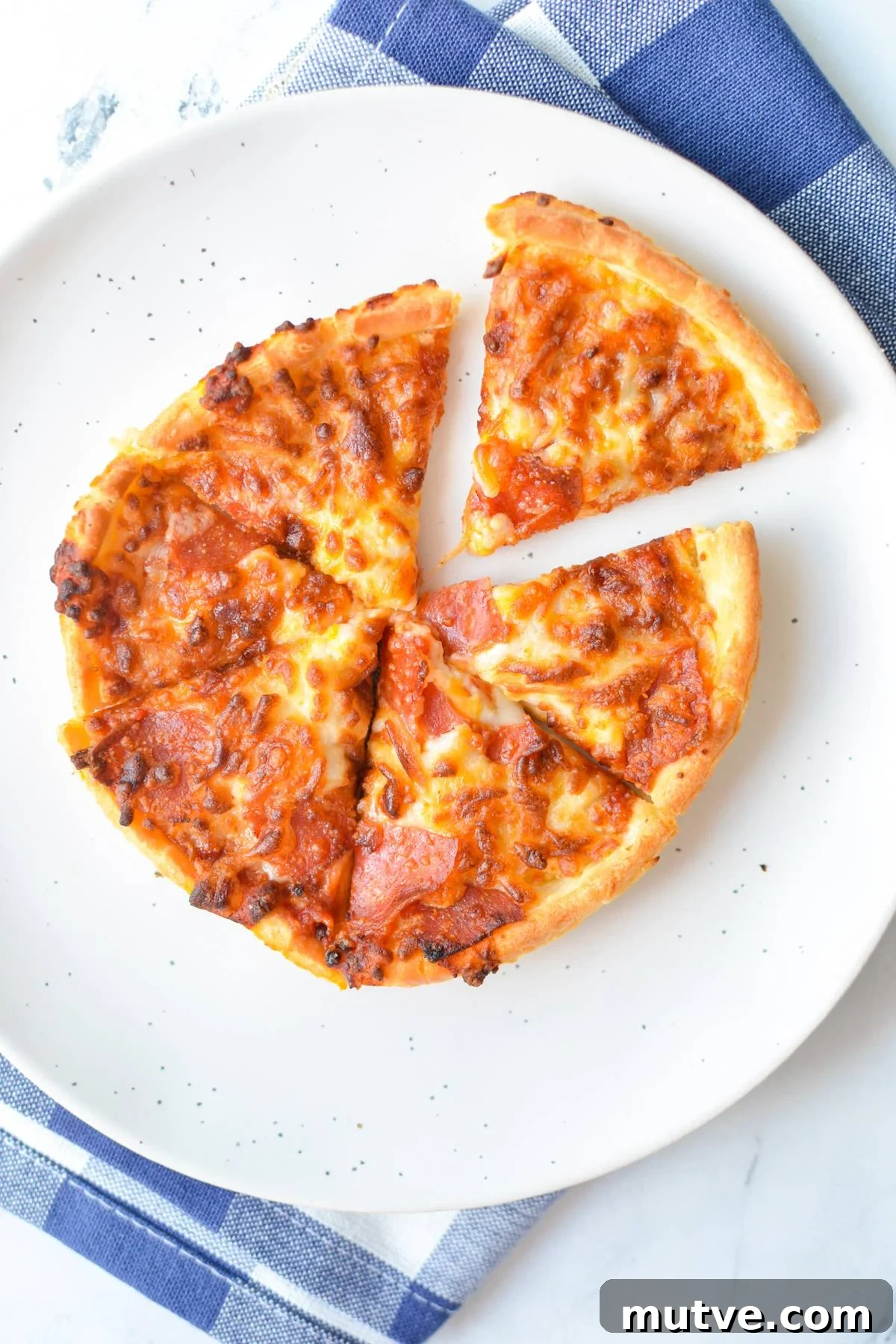 Crispy Frozen Mini Pizzas in the Air Fryer 2 A mini pizza cut into 6 slices.