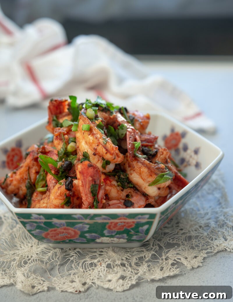 Quick Chili Garlic Shrimp with Chili Crisp Recipe 8 Chili garlic shrimp made with chili crisp is garnished green onion.