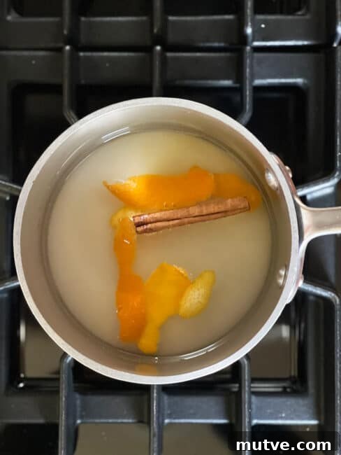 Tishpishti Honey Almond Cake with Citrus Syrup 5 Syrup in the pot ready to cook on top of the stove.