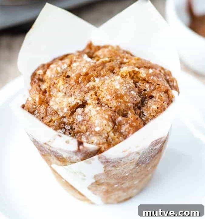 Close up shot of banana dulce de leche muffin on a white plate