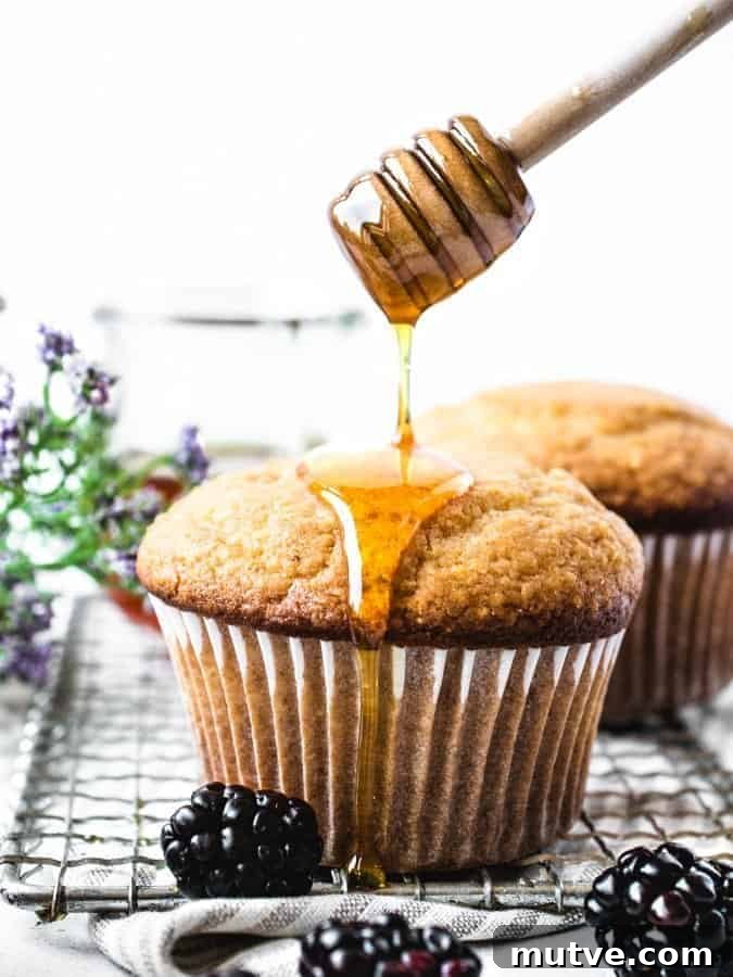 Homemade Honey Corn Muffins Recipe 10 Corn Muffin being drizzled with honey