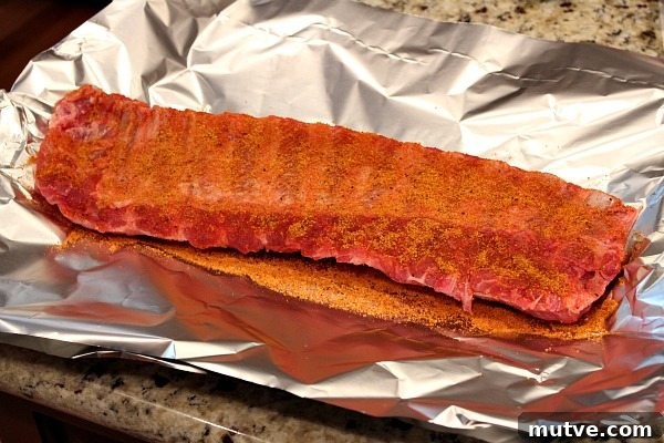 Making Ribs in the Oven ribs with rub on a sheet of foil
