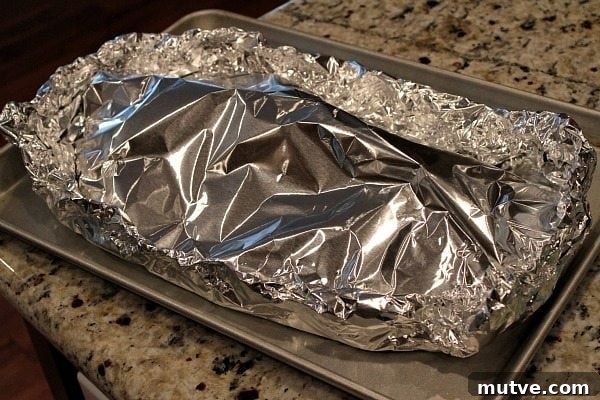 Making Ribs in the Oven ribs wrapped with foil ready for the oven