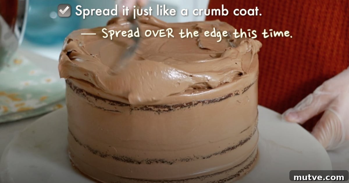 How to Frost a Cake: Step-by-Step for Smooth Icing 13 spreading chocolate buttercream on top of a cake as a final coat