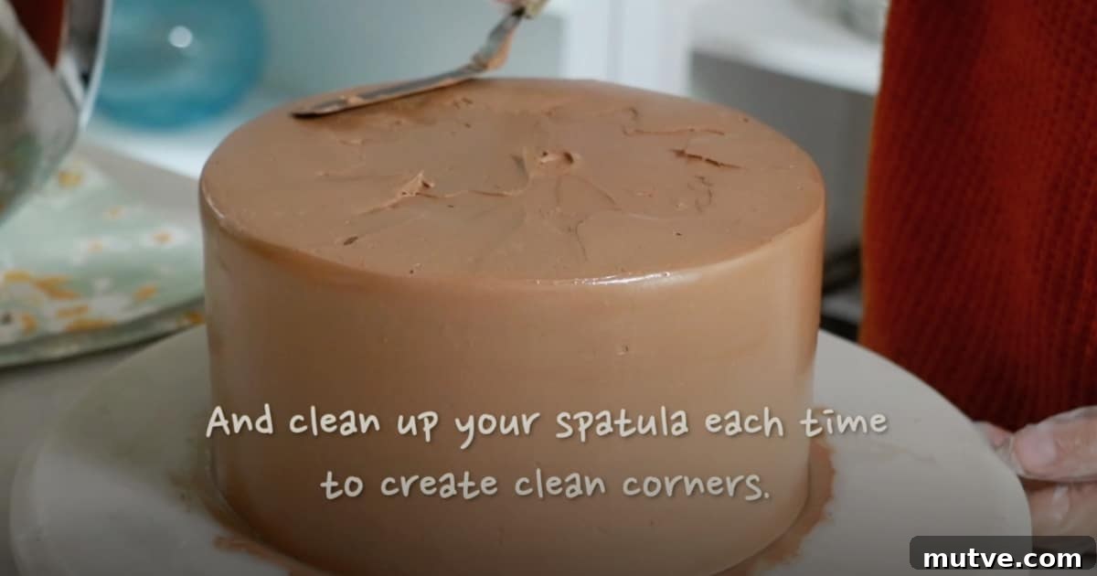 How to Frost a Cake: Step-by-Step for Smooth Icing 19 creating sharp clean edge of a cake with a spatula to frost a cake