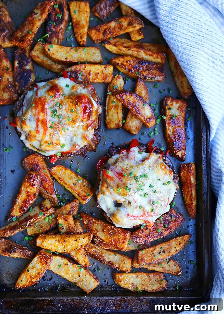 Philly Cheesesteak Stuffed Portobello Mushrooms Recipe 3 Close-up of stuffed mushrooms with melted cheese