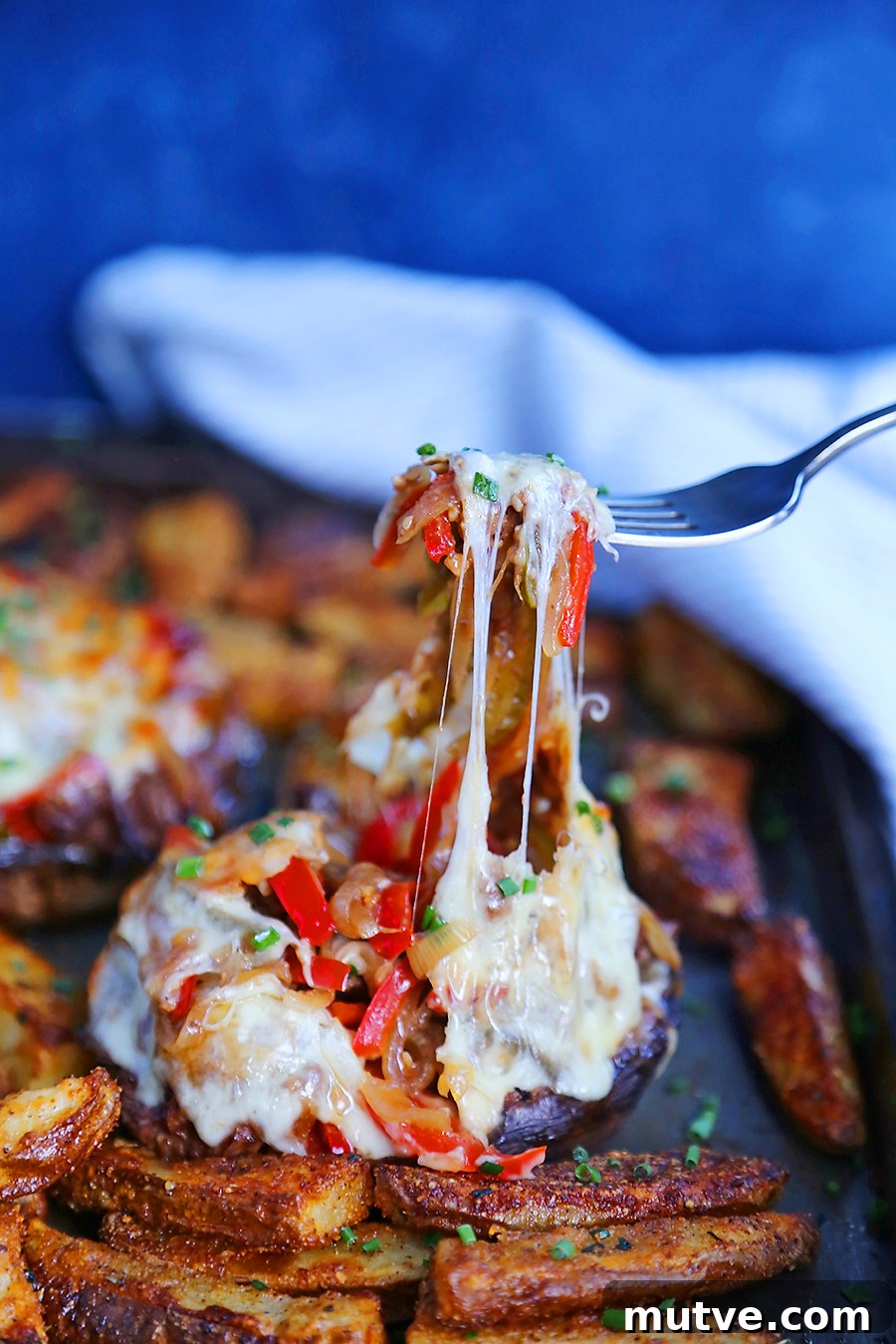 Philly Cheesesteak Stuffed Portobello Mushrooms Recipe 4 Plated portobello cheesesteaks with melted provolone