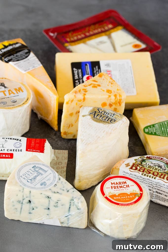 Different cheeses wrapped in plastic.