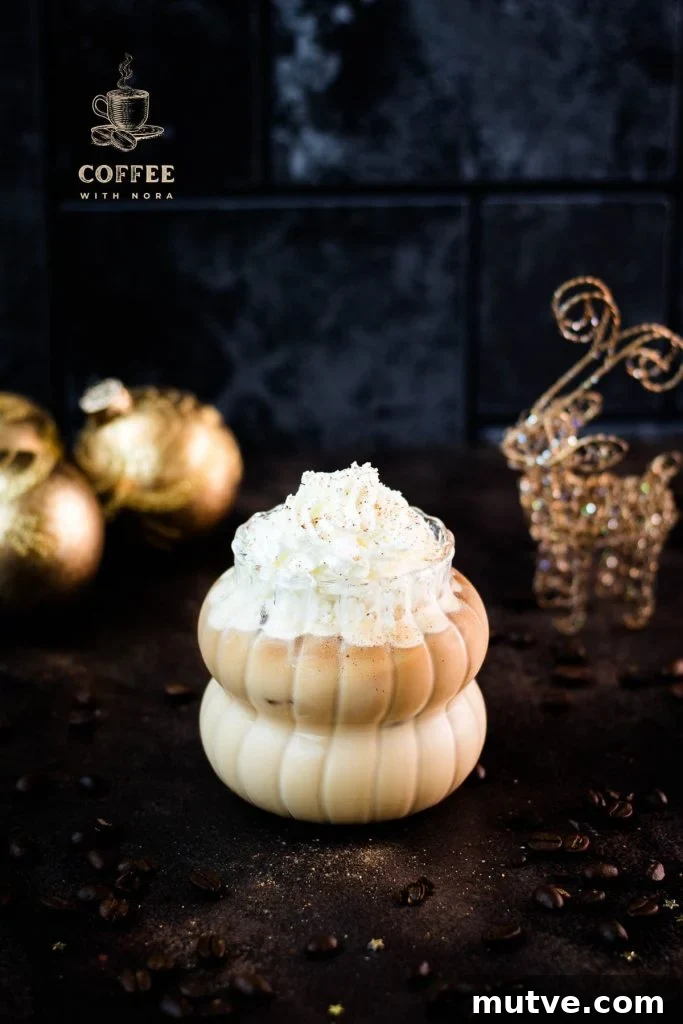 Gorgeous iced eggnog latte, topped with whipped cream and dusted with nutmeg. So festive.
