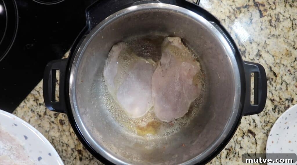 Creamy Instant Pot Chicken Baconara Pasta 11 Searing chicken in pot