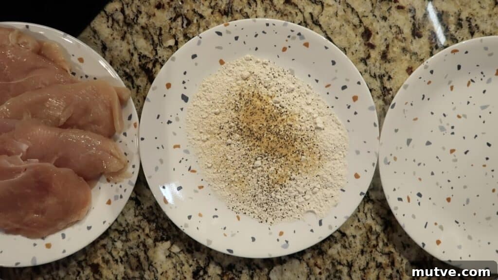 Creamy Instant Pot Chicken Baconara Pasta 3 Line up three plates: one with chicken cutlets, one with a flour mixture, and one with nothing on it.