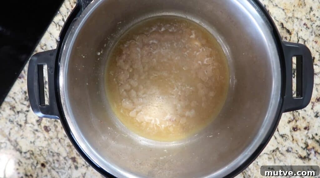 Creamy Instant Pot Chicken Baconara Pasta 21 Liquid bubbling in pot