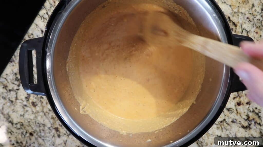 Creamy Instant Pot Chicken Baconara Pasta 26 Stirring until sauce is fully combined