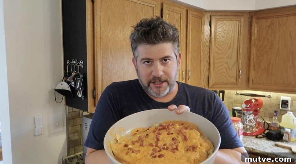 Creamy Instant Pot Chicken Baconara Pasta 30 Man holding platter of chicken