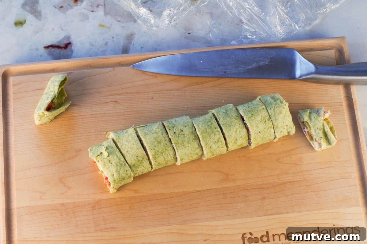 Chicken Tortilla Pinwheels Recipe: Cheesy Party Appetizer 13 Ends cut off tortilla and tortilla cut into equal sized pieces.