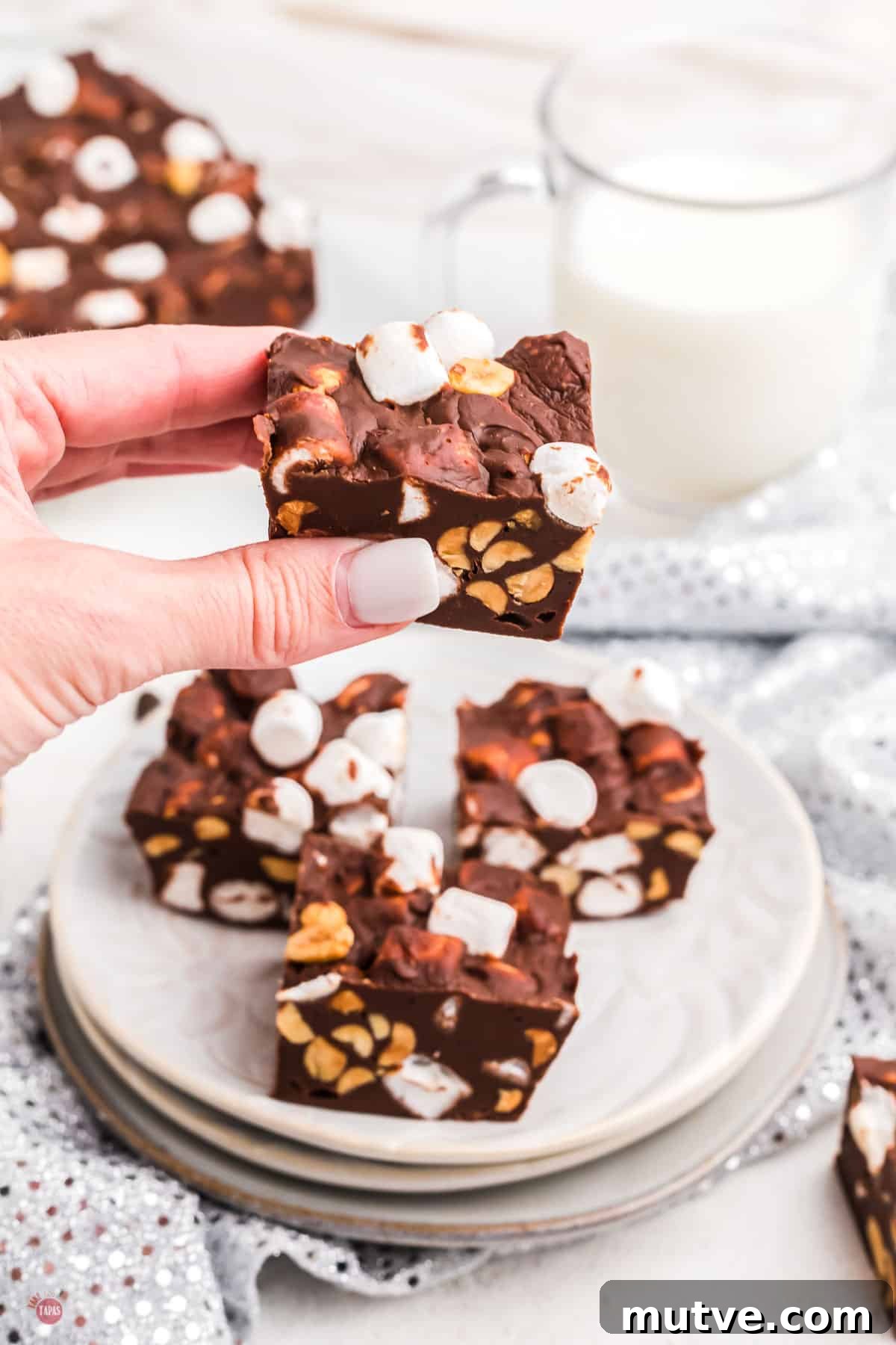 hand holding piece of fudge
