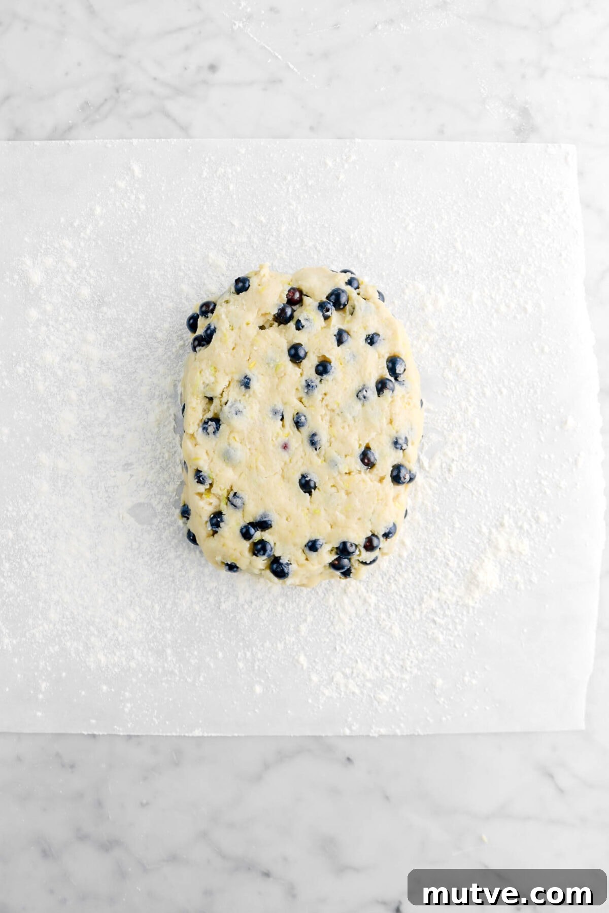 scone dough on floured parchment paper