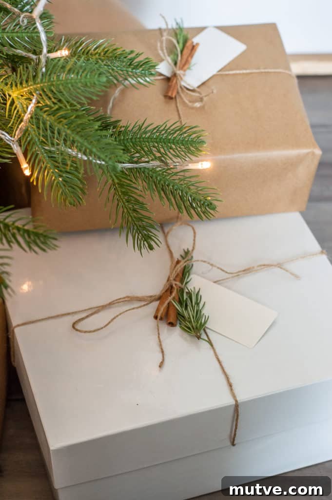 DIY Kraft paper wrapped christmas presents with cinnamon, twine and rosemary