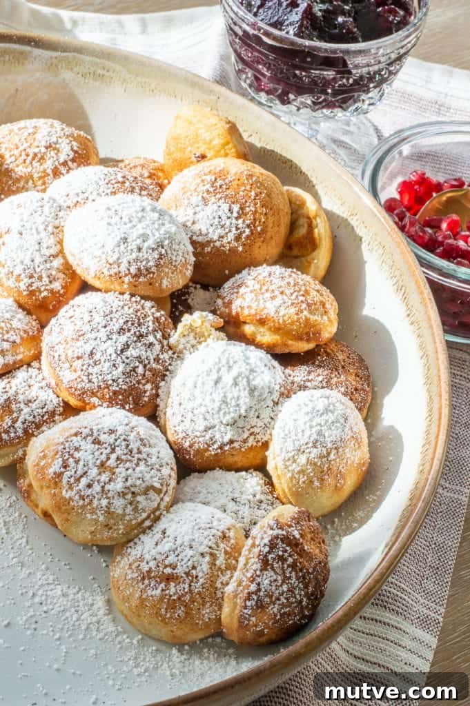 Ebelskiver recipe with powdered sugar on top in a bowl