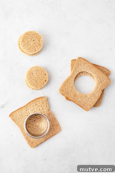 Smoked Salmon Tea Sandwiches Recipe with Cream Cheese and Dill 6 Cutting circles out of the bread using a round cookie cutter.