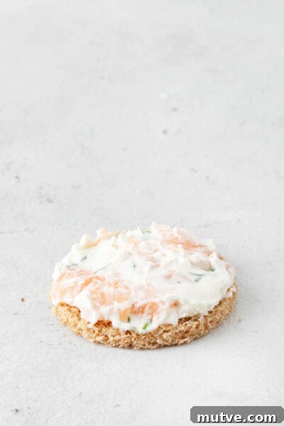 Smoked Salmon Tea Sandwiches Recipe with Cream Cheese and Dill 7 Making a smoked salmon tea sandwich.
