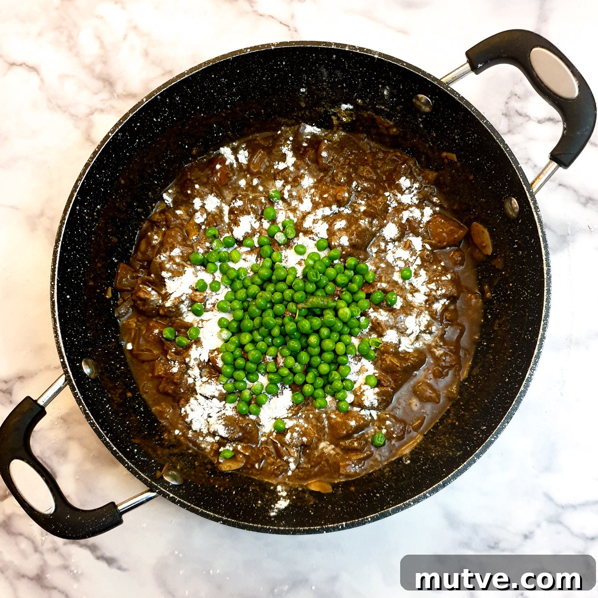 Peas and flour added to the lamb pie filling.