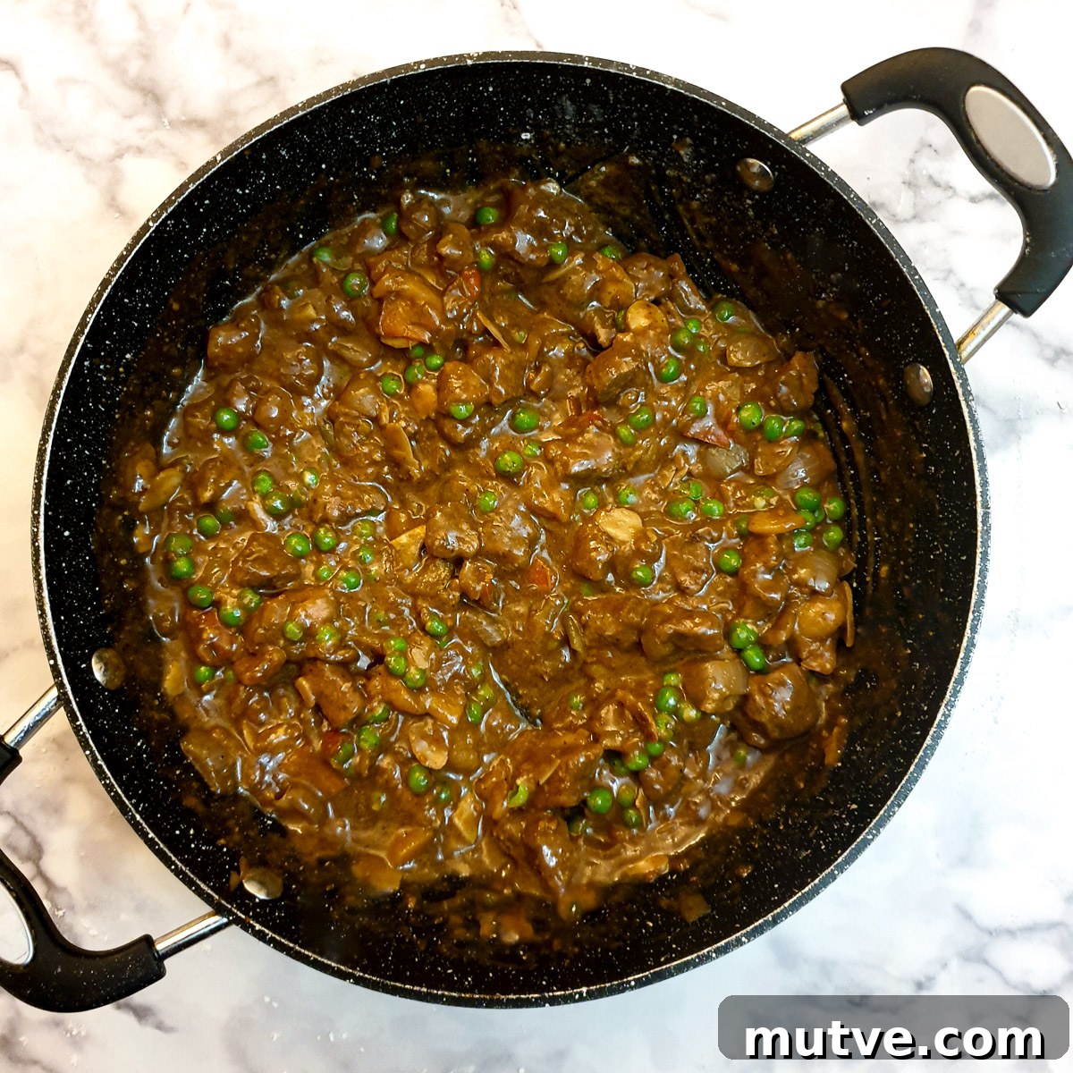 Moroccan lamb pie filling ready to be assembled in the pie.