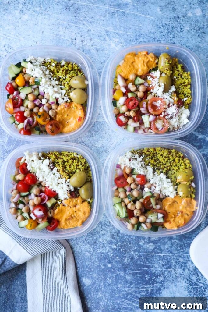 Mediterranean Power Bowl Recipe with Chickpeas and Tahini 8 clear plastic containers with mediterranean power bowls with quinoa, feta, olives, hummus, and tomato cucumber salad