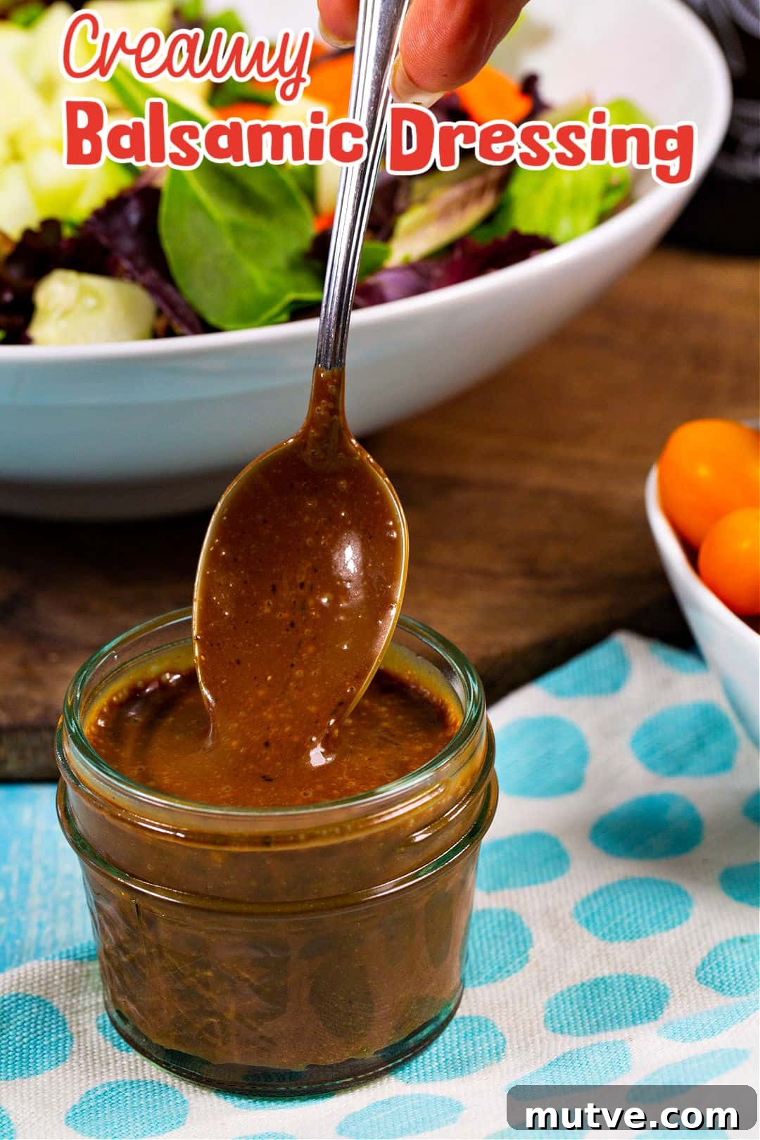Spoon going into jar of dressing.