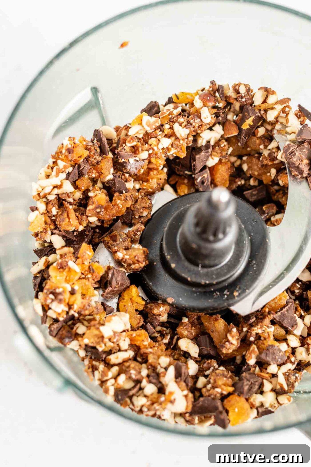 Homemade Apricot Muesli Granola Bars 6 Blended dates, apricots, almonds and dark chocolate in a food processor.