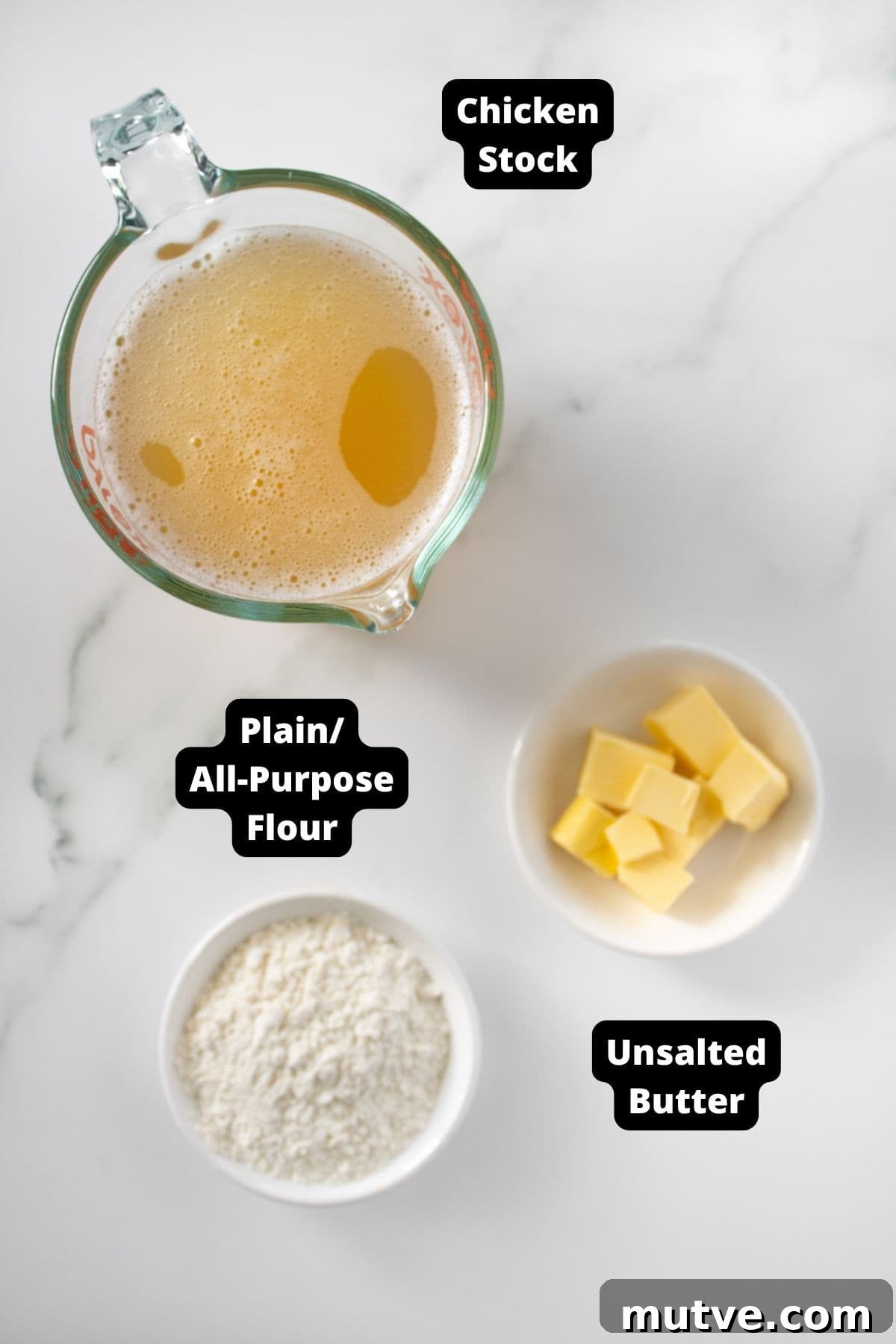 3-Ingredient Chicken Gravy Without Pan Drippings 3 Ingredients in this recipe on a white marble background.
