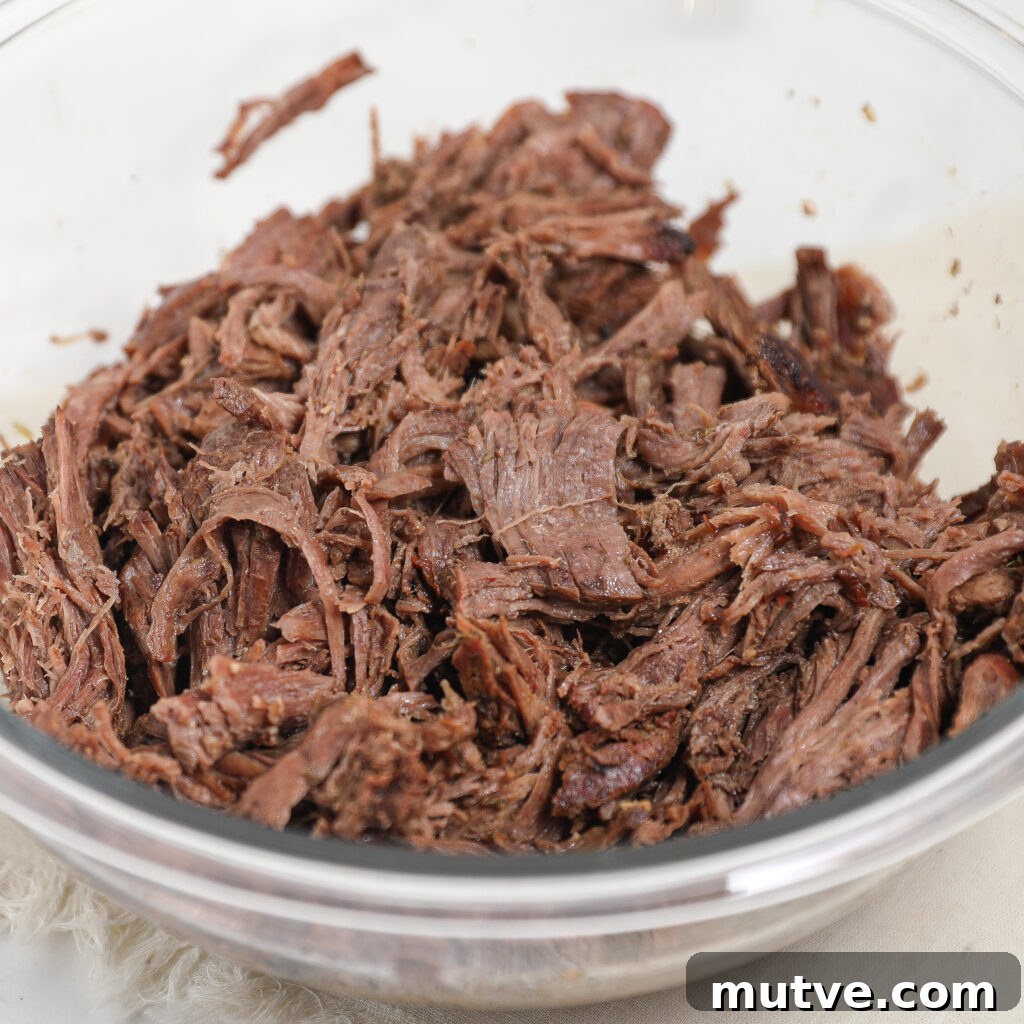 How to Make Authentic Barbacoa Beef 5 Tender shredded barbacoa in a serving dish