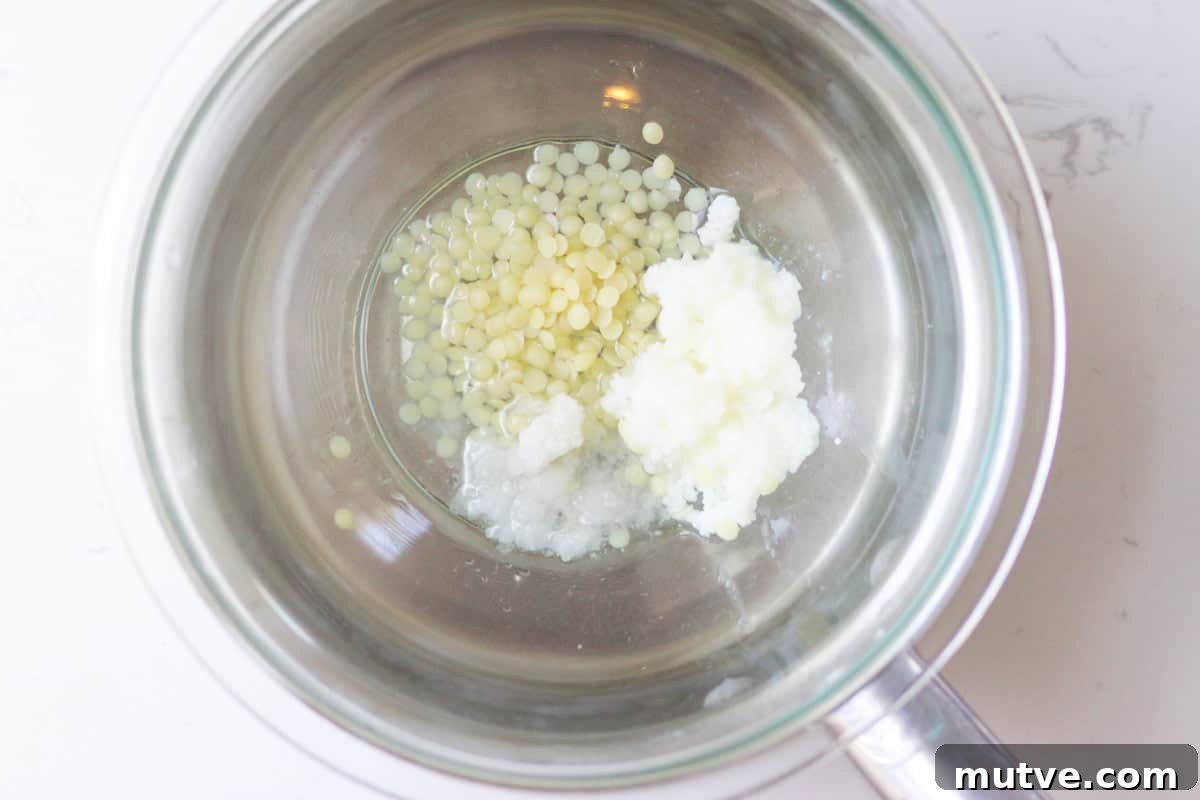 Beeswax Lip Balm Recipe: How to Make Soft, Hydrated Lips 4 a saucepan with beeswax, shea butter and coconut oil in it