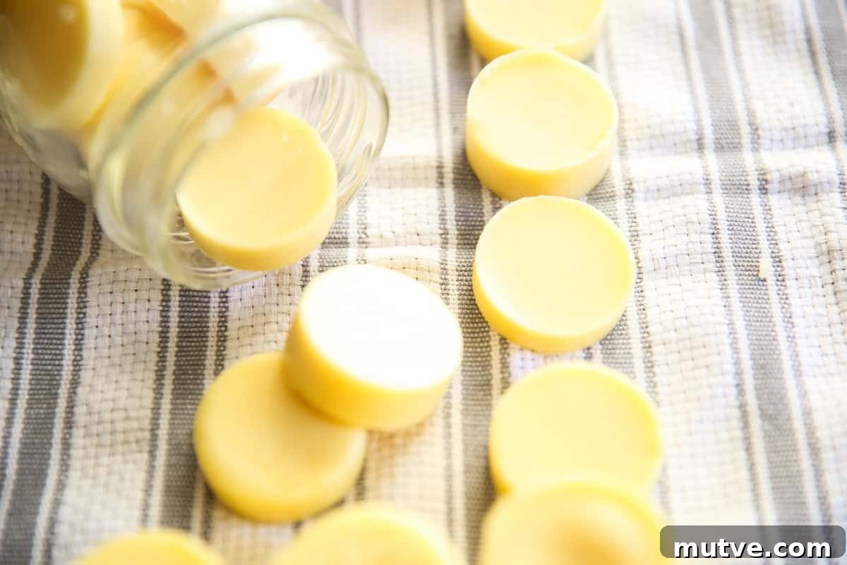 Homemade lotion bars on white and gray towel in a mason jar.