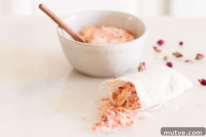 A bag of rose bath salts with a bowl in the background. 