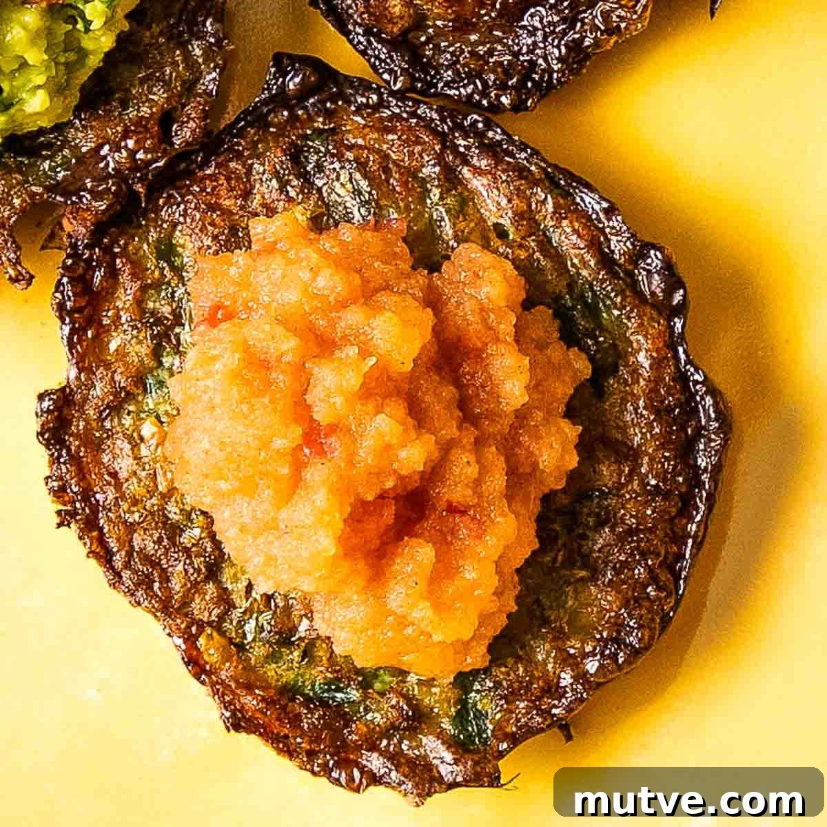 Crispy Oven Baked Brussels Sprouts Latkes 8 Crispy latke topped with pink applesauce.