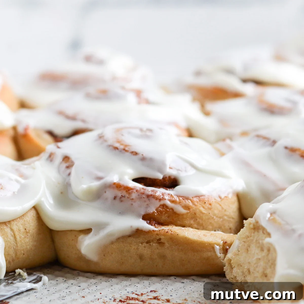 Homemade Whole-Wheat Cinnamon Rolls Recipe 8 side shot showing height of baked cinnamon roll