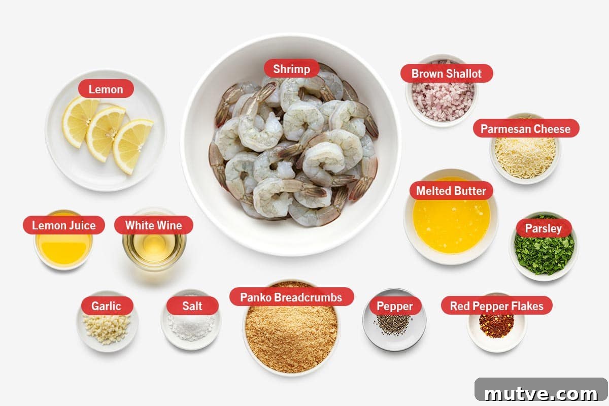 Crispy Oven-Baked Shrimp Scampi Recipe with Garlic Butter 3 Top shot of ingredients: lemon, lemon juice, white wine, garlic, salt, panko breadcrumbs, pepper, shrimp, brown shallot, parmesan cheese, melted butter, red pepper flakes, and parsley.