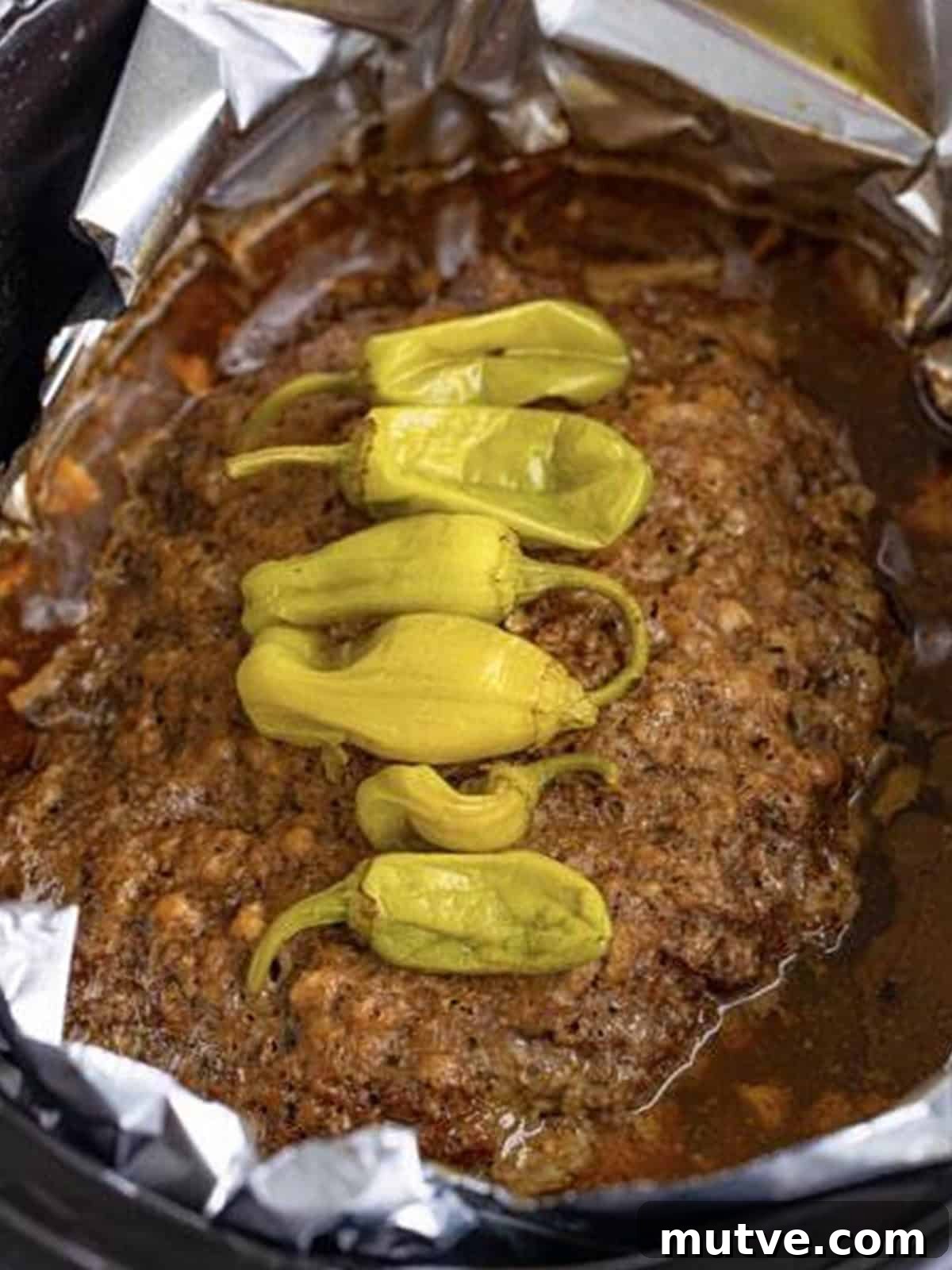 Slow Cooker Mississippi Meatloaf Recipe 13 Crockpot meatloaf fully cooked in the slow cooker with gravy and pepperoncini.