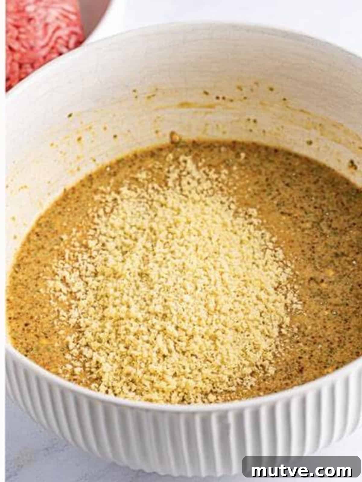 Slow Cooker Mississippi Meatloaf Recipe 6 Panko breadcrumbs added to the whisked wet base for crockpot meatloaf.