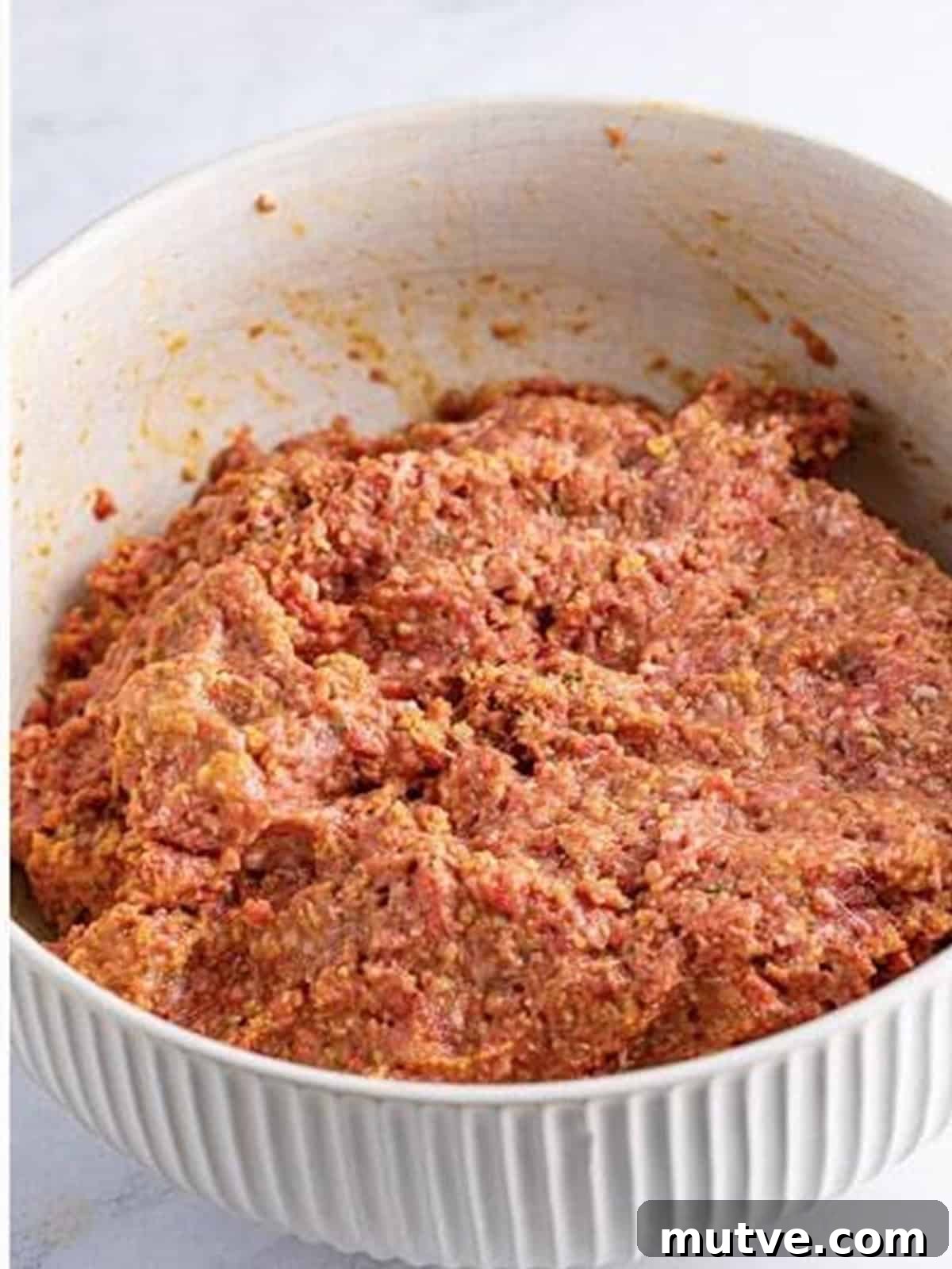 Slow Cooker Mississippi Meatloaf Recipe 8 Meatloaf mixture combined by hand until just mixed for crockpot meatloaf.