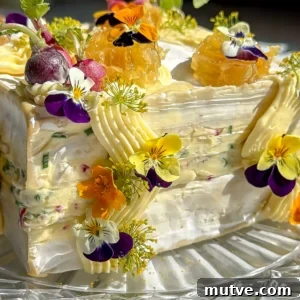Baked Brie Cake with French Radish Butter Recipe 15 Close up of brie square layered with whipped radish butter and decorated with mini radishes and honeycomb.