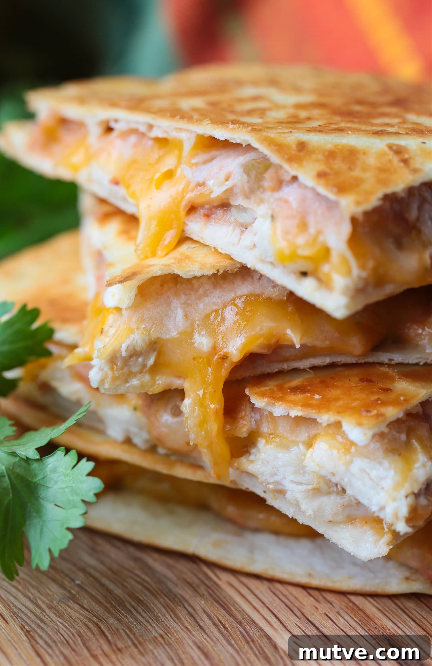 Stacked chicken quesadillas chicken quesadillas stacked on a board