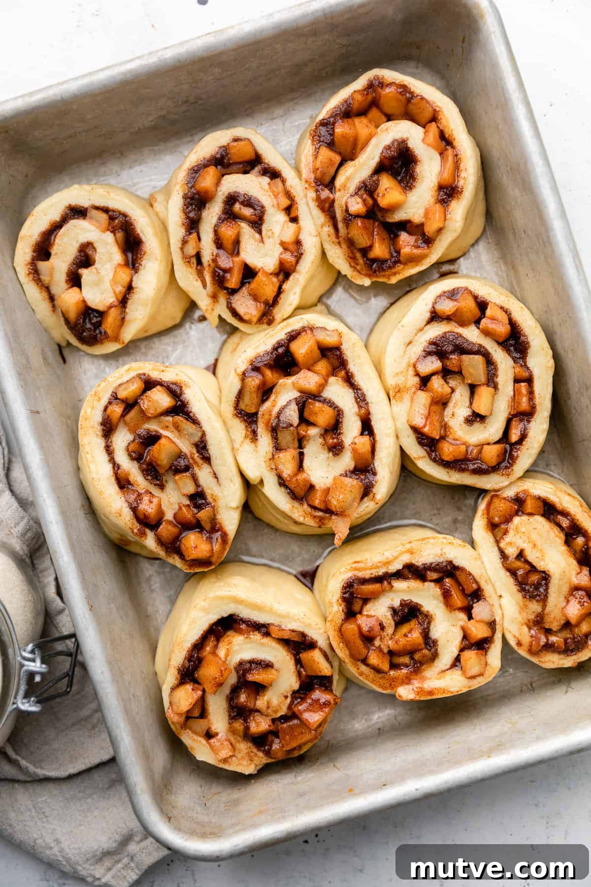 unbaked apple cinnamon rolls in pan